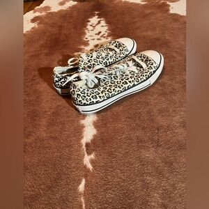 Converse 
kids size 3 cheetah print 
They are low tops